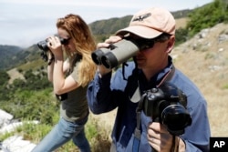 Ventana Wildlife Society executive director Kelly Sorenson, right, and wildlife biologist Amy List monitor California condors in the Ventana Wilderness east of Big Sur, California, June 21, 2017.