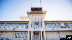 FILE - In this photo reviewed by U.S. military officials, the Office of Military Commissions building used for Periodic Review Board hearings stands, on April 18, 2019, in Guantanamo Bay Naval Base, Cuba. 