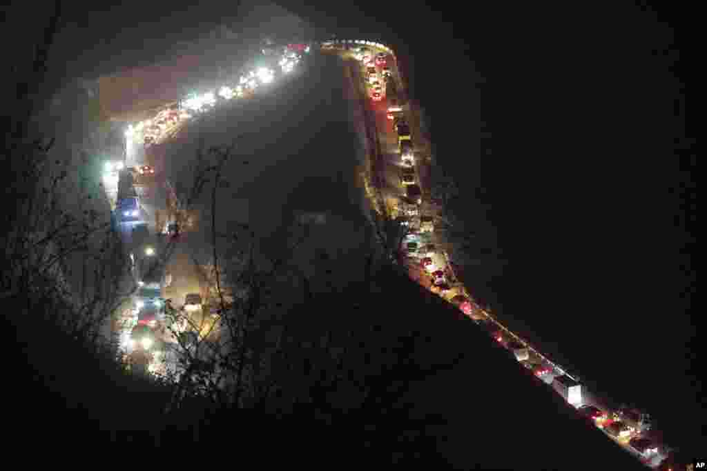 Cars and trucks stuck in a huge traffic jam are seen on the road from Kalbajar to a mountain pass leaving the separatist region of Nagorno-Karabakh to Armenia, Nov. 14, 2020.