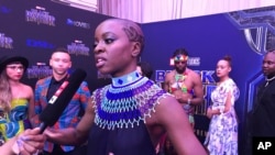 Danai Gurira speaks as the cast of “Black Panther” arrives at the South Africa premiere, Feb. 16, 2018, in Johannesburg.