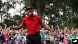 Tiger Woods reacts as he wins the Masters golf tournament Sunday, April 14, 2019, in Augusta, Ga.