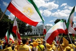 Activists hold an "Uprising for Regime Change" rally and "solidarity march with the Iranian resistance" outside the White House in Washington, June 21, 2019.