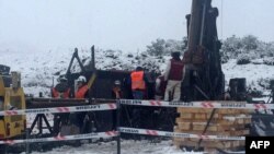 This handout picture released by the Regional Council of Aysen (Intendencia Aysen) shows Chilean rescuers working to save two miners trapped at the Delia 2 mine, operated by the Canadian company Mandalay Resources, about 1600 km south of Santiago, in Aysen Region, June 14, 2017.