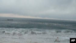 A tsunami wave approaches the Fukushima nuclear plant on March 11, 2011