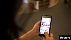 FILE - Logos of Israeli mobile phone company Cellcom, are seen on a mobile phone in this picture illustration taken in Jerusalem, Dec. 19, 2019. 