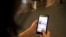FILE - Logos of Israeli mobile phone company Cellcom, are seen on a mobile phone in this picture illustration taken in Jerusalem, Dec. 19, 2019. 
