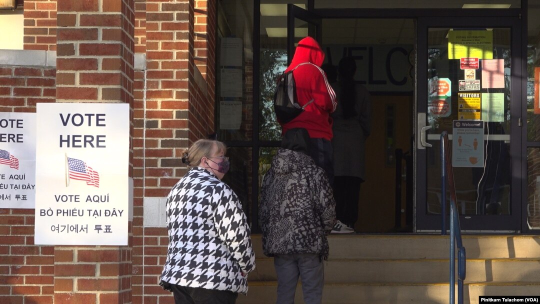 People line up to cast their vote at a polling station on Election Day in Springfield, VA, U.S., November 3, 2020.