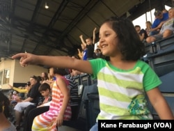 In Afghanistan, people are big fans of soccer not baseball, Kazam Hashimi said, while his children, ages 6, 5 and 3, enjoy their first Major League Baseball game in PNC Park, Aug. 1, 2017, in Pittsburgh.