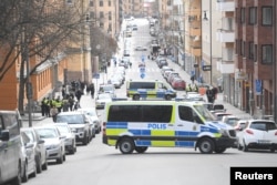 Police vans block the street outside the Stockholm District Court as Uzbek national Rakhmat Akilov, prime suspect in a truck attack that killed 4 people, appears in court, in Stockholm, Sweden, April 11, 2017.