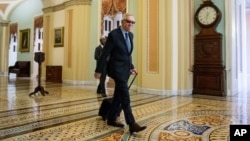 Senate Minority Leader Harry Reid, a Nevada Democrat, arrives at the Capitol before the Senate convenes for a Sunday session in Washington, July 26, 2015.