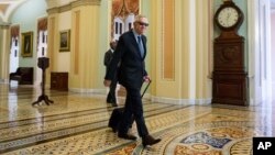 Senate Minority Leader Harry Reid, a Nevada Democrat, arrives at the Capitol before the Senate convenes for a Sunday session in Washington, July 26, 2015.