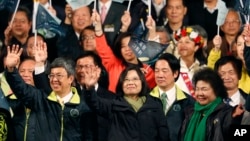 Taiwan's Democratic Progressive Party, DPP, presidential candidate, Tsai Ing-wen, waves as she declares victory in the presidential election in Taipei, Taiwan, Jan. 16, 2016.