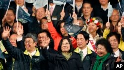 Taiwan's Democratic Progressive Party, DPP, presidential candidate, Tsai Ing-wen, waves as she declares victory in the presidential election in Taipei, Taiwan, Jan. 16, 2016.