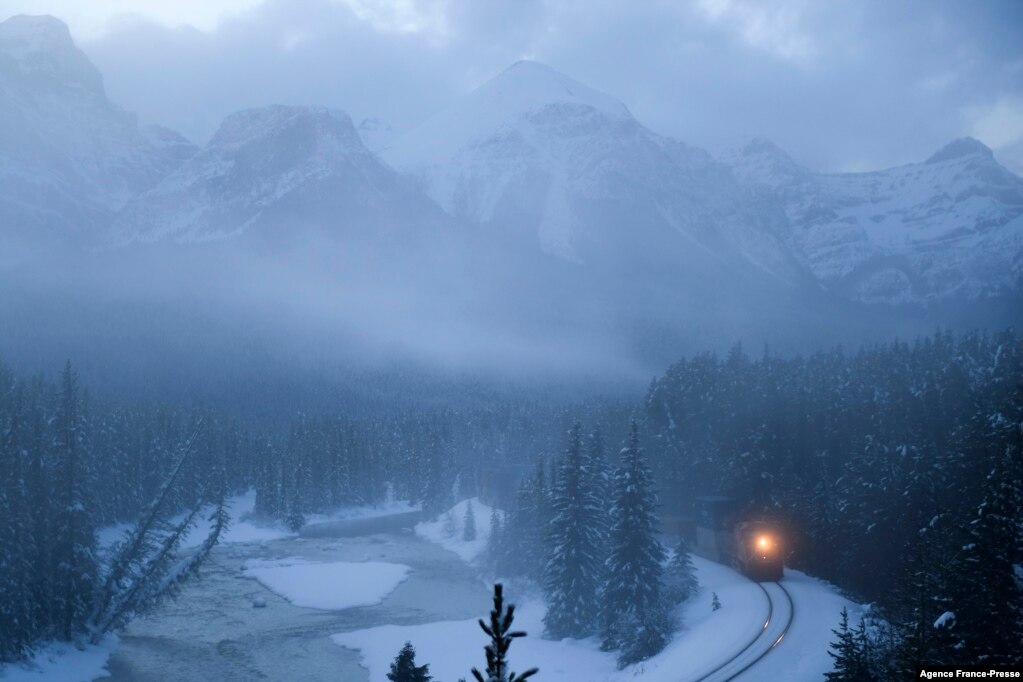 A Canadian Pacific freight train is seen past Morant's Curve near Lake Louise in Banff National Park, Alberta, Canada, Nov. 29, 2021.