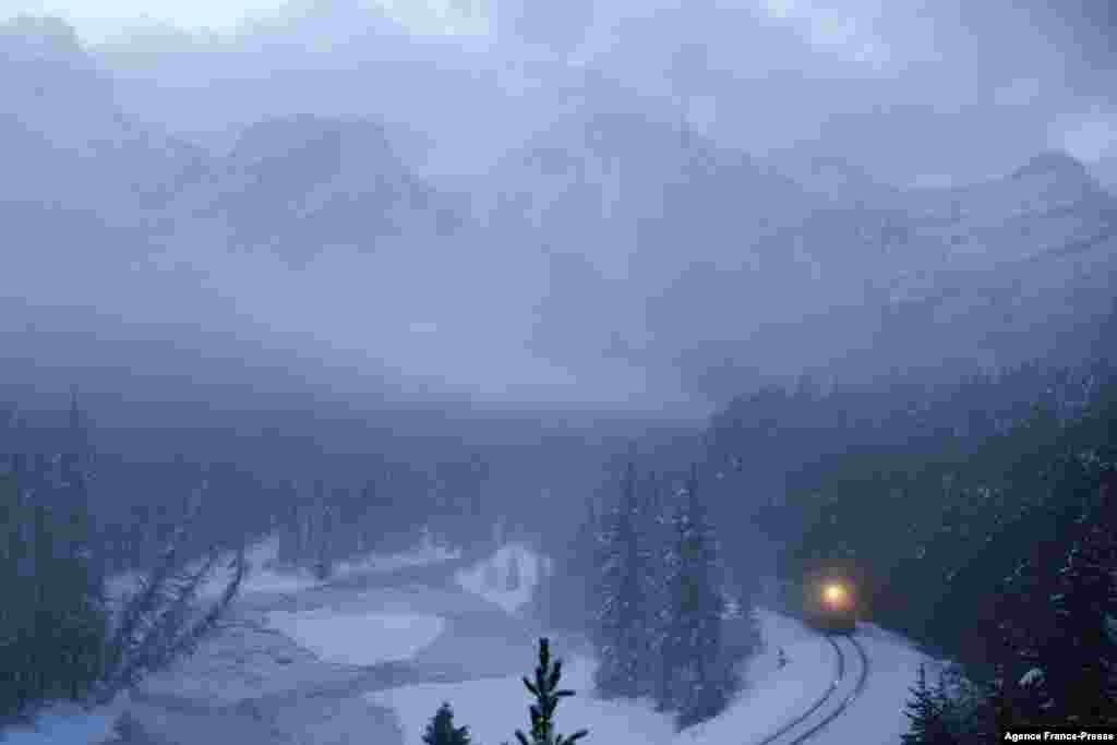 A Canadian Pacific freight train is seen past Morant&#39;s Curve near Lake Louise in Banff National Park, Alberta, Canada, Nov. 29, 2021.