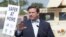 FILE - Florida Governor Ron DeSantis speaks during a news conference at a drive-through coronavirus testing site in front of Hard Rock Stadium, in Miami Gardens, Florida, March 30, 2020.