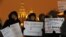 Opposition activists hold posters reading "Do not involve children in politics" and "Lawmakers, children are not your ownership" during a protest against a bill banning U.S. adoptions of Russian children in St. Petersburg, Russia, December 26, 2012.
