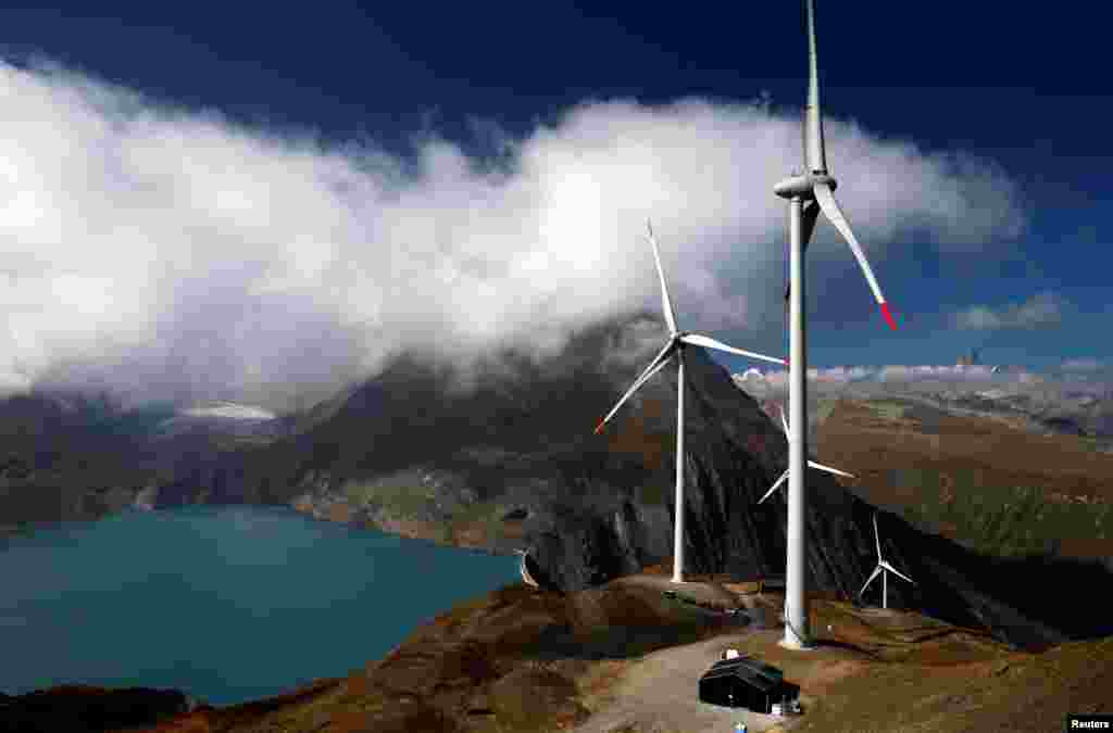 Wind turbines are pictured at Swisswinds farm, Europe&#39;s highest wind farm at 2,500m, before the topping out ceremony near the Nufenen Path in Gries, Switzerland.
