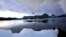FILE - An iceberg melts in Kulusuk, Greenland near the arctic circle. A new report finds permafrost in the Arctic is thawing faster than ever before.