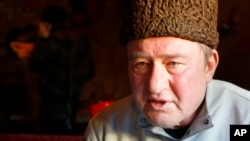 FILE - In this photo taken on Monday, Jan. 25, 2016, a Crimean Tatar leader, Ilmi Umerov, speaks during an interview to the Associated Press in Simferopol, Crimea. An international rights group has urged Russia to release Umerov who has been sent to a psychiatric hospital. 
