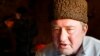 FILE - In this photo taken on Monday, Jan. 25, 2016, a Crimean Tatar leader, Ilmi Umerov, speaks during an interview with the Associated Press in Simferopol, Crimea. 