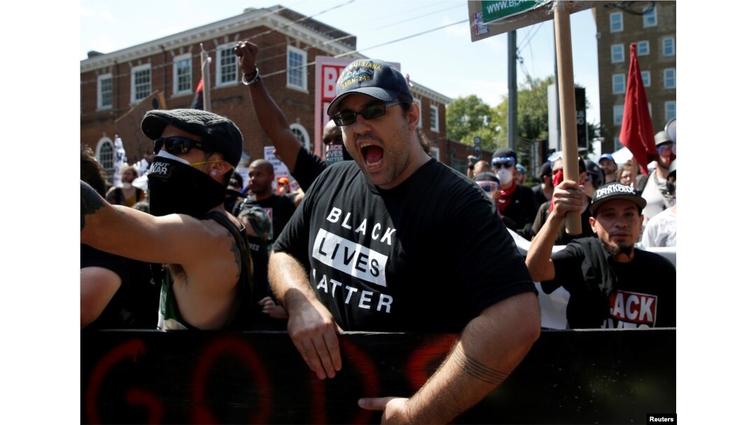 A counter protester yells at white supremacists during a rally in Charlottesville, Virginia, August 12, 2017.