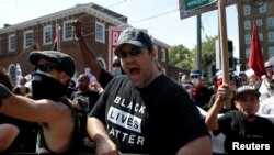 A counter protester yells at white supremacists during a rally in Charlottesville, Virginia, August 12, 2017.