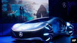 Daimler announces the world premiere of the Mercedes-Benz Vision AVTR concept car at the Daimler Keynote along with a sneak peek of the new Avatar 2 movie, background image, before the CES tech show Monday, Jan. 6, 2020, in Las Vegas. (AP Photo/Ross…