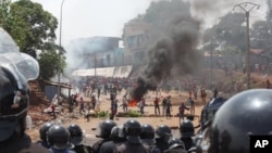 FILE - Opposition protestors clash with police in Conakry, Guinea, May 2013.