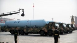 FILE - Military vehicles carrying JL-2 submarine-launched missiles roll during a parade to commemorate the 70th anniversary of the founding of the People's Republic of China in Beijing, Oct. 1, 2019.