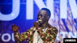 FILE - Comedian Kuech Deng Atem performs during the "Comedy for Peace" event, supported by the United Nations Mission in South Sudan (UNMISS), held at the Nyakuron Cultural Centre, April 23, 2017, in Juba. (Photo courtesy UNMISS)