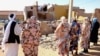 File - People pray for the victims of a drone strike in El Obeid, North Kordofan State, Sudan, January 12, 2026.