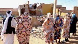 File - People pray for the victims of a drone strike in El Obeid, North Kordofan State, Sudan, January 12, 2026.