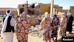 File - People pray for the victims of a drone strike in El Obeid, North Kordofan State, Sudan, January 12, 2026.