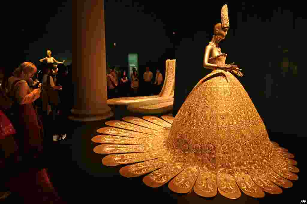 A collection of dresses created by Chinese designer Guo Pei are seen at the Asian Civilisations Museum during an early showing of the exhibition, "Guo Pei: Chinese Art and Couture" in Singapore.