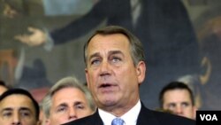 House Speaker John Boehner of Ohio, surrounded by his colleagues, speaks during a news conference on Capitol Hill in Washington, Tuesday, Dec. 20, 2011. The House Tuesday rejected a plan backed by President Barack Obama to extend a 2 percentage point payr