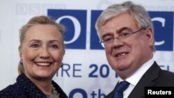 U.S. Secretary of State Hillary Clinton meets Irish Foreign Minister Eamon Gilmore at the Organization for Security and Co-operation in Europe (OSCE) conference opening session in Dublin, December 6, 2012. 