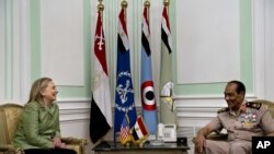 U.S. Secretary of State Hillary Rodham Clinton, left, meets with Field Marshal Hussein Tantawi, right, at the Ministry of Defense in Cairo, Egypt, July 15, 2012.