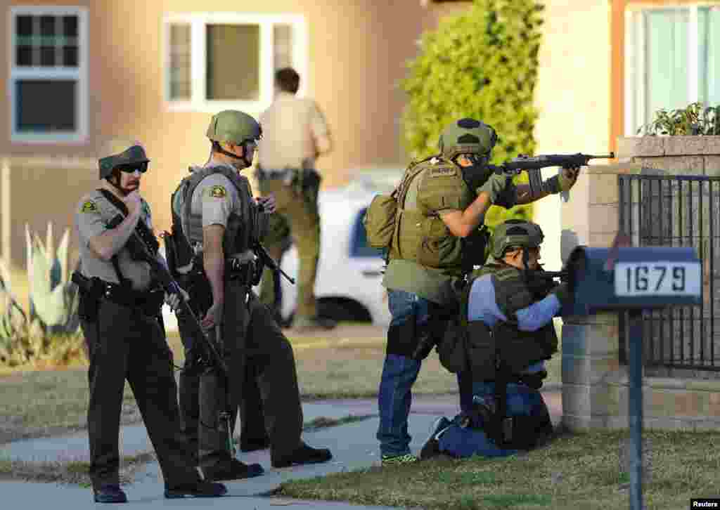 Police conduct a manhunt after gunmen opened fire on a holiday party in San Bernardino, California Dec. 2, 2015.