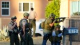 Police conduct a manhunt after gunmen opened fire on a holiday party in San Bernardino, California December 2, 2015.