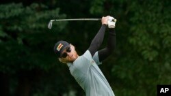 Scott Vincent of Zimbabwe XX watches his tee shot on the fourth hole during the second round of the men's golf event at the 2020 Summer Olympics on Friday, July 30, 2021, at the Kasumigaseki Country Club in Kawagoe, Japan. (AP Photo/Matt York)