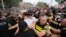 FILE - Police block Georgian opponents of gay rights as they try to interfere with a pride event in Tbilisi on July 8, 2023. Georgia's parliament on June 27, 2024, advanced several anti-LGBTQ+ bills.