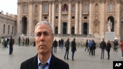 In this image taken from a video provided by Adnkronos International, Ali Agca stands in front of St. Peter's Basilica at the Vatican, Dec. 27, 2014. 