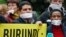 Amnesty International activists demonstrate against a new law limiting press freedom in Burundi during a protest in front of the Burundi embassy in Brussels, May 31, 2013. 