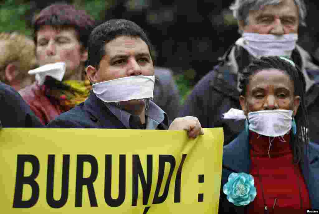 Amnesty International activists demonstrate against a new law limiting press freedom in Burundi during a protest in front of the Burundi embassy in Brussels. 