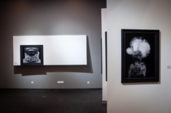 Photographs by Cameroonian artist Angèle Etoundi Essamba titled “Rêve brisé” are displayed at Dakar's Museum of Black Civilizations. (Photo: A. Hammerschlag/VOA)