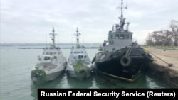 Ukrainian naval ships seized by Russia are seen docked in Kerch, in Russia-annexed Crimea, in this image from video released by Russia's Federal Security Service, Nov. 27, 2018.