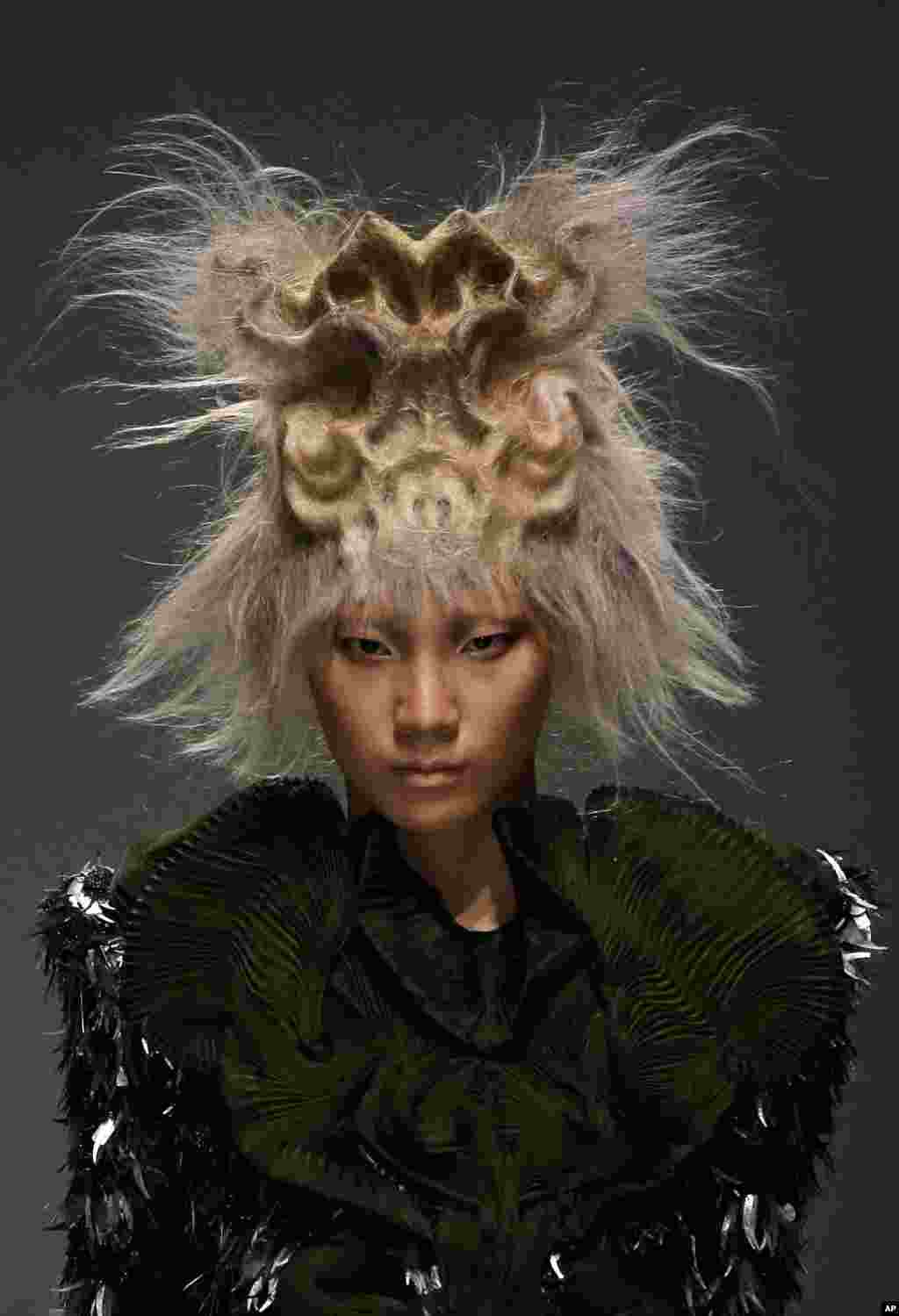 A model presents a creation from Toni & Guy 2015 Hairstyling Trends collection during China Fashion Week in Beijing.