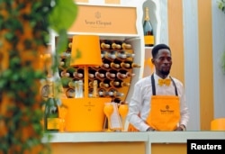 A bartender stands at a Veuve Clicquot champagne bar during the 2019 Lagos International Polo Tournament in Lagos, Nigeria, March 16, 2019.