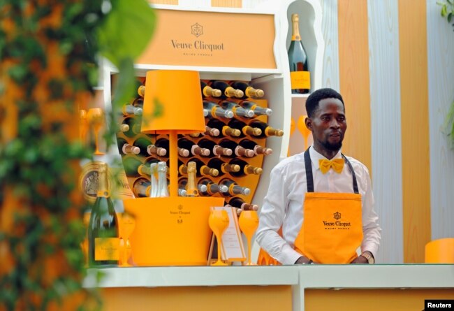 A bartender stands at a Veuve Clicquot champagne bar during the 2019 Lagos International Polo Tournament in Lagos, Nigeria, March 16, 2019.
